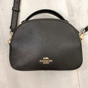 Coach black cross body bag in textured leather.